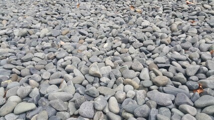 Rock Pebbles, small, rounded, smooth rocks. Texture background for text
