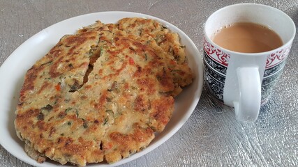 Closeup view of of traditional bread called Jawar roti or bhakri with tea cup