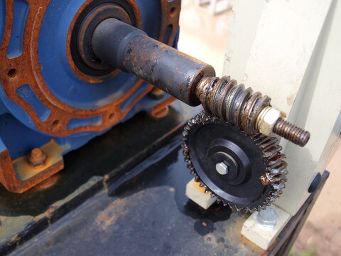 Worm gear or worm drive tramsission. From the electric motor driving the outdoor floodgates gear system. Focus close and choose the subject.