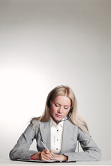 business woman writing in notebook