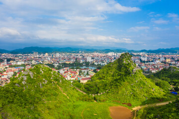 Aerial landscape: Ancient wall of The Mac dynasty as known as Northern Mac or House of Mac, old ruins located on a mountain with panoramic city Lang Son backwards, Vietnam.