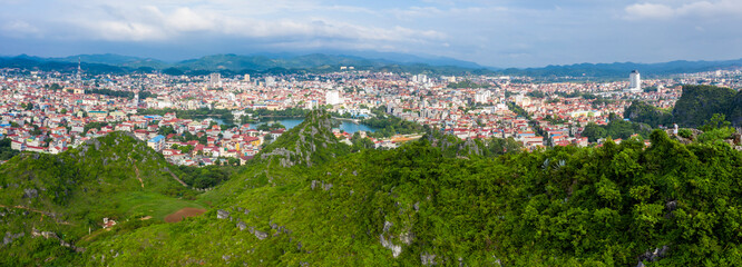 Aerial landscape: Ancient wall of The Mac dynasty as known as Northern Mac or House of Mac, old ruins located on a mountain with panoramic city Lang Son backwards, Vietnam.