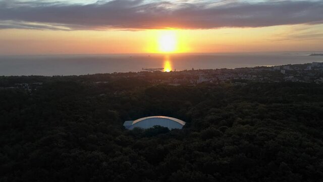 Sun Rising In The Horizon - Dome Of The Forest Opera - Sopot Poland - Aerial Shot