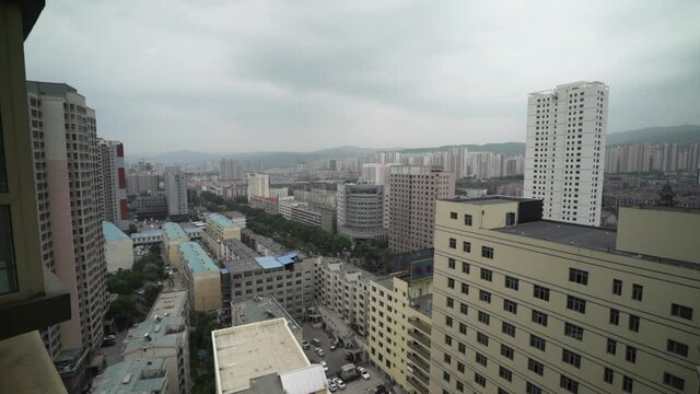 Xining City China on a Cloudy Evening - Wide Pan Shot over Chinese Skyscrapers