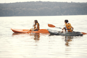 Kayaking. A women in a kayak. Girls paddling in the water.