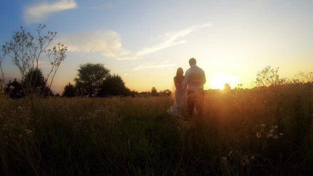 Silly Wedding Blooper Where The Groom Tries To Dance With The Bride And She Trips In A Kansas Meadow