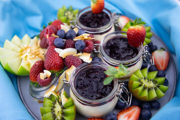 Home made cheese cake with a selection of fruits and blueberry topping