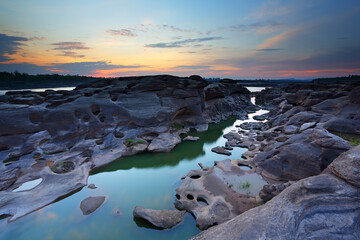 Sunrise of sampanbok (3000 Hole), The Amazing of Rock in Mekong River, Ubon Ratchathani, Thailand