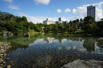 Beautiful Japanese garden with a pond and trees, leaves, nature landscape in Toyama castle, Japan