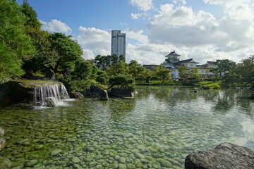 Fototapeta na wymiar Beautiful Japanese garden with a pond and trees, leaves, nature landscape in Toyama castle, Japan