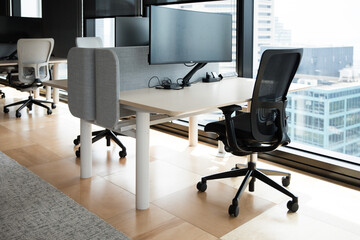 Modern flexible office work space interior fitout rows desks chairs floor cieiling windows T5 lights computer stations screens cityview	
