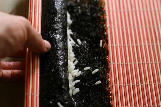 Woman Making California Roll Close-up