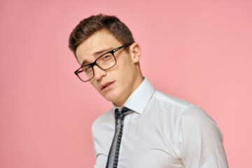 Business man in white shirt with tie wearing glasses self-confidence official pink background