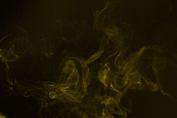 Yellow steam on a black background.
