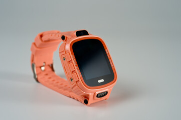 An electronic wristwatch of pink color with gps for teenagers and children.