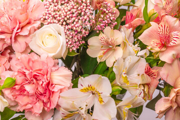 Bouquet of  soft pink flowers in wrapping paper.