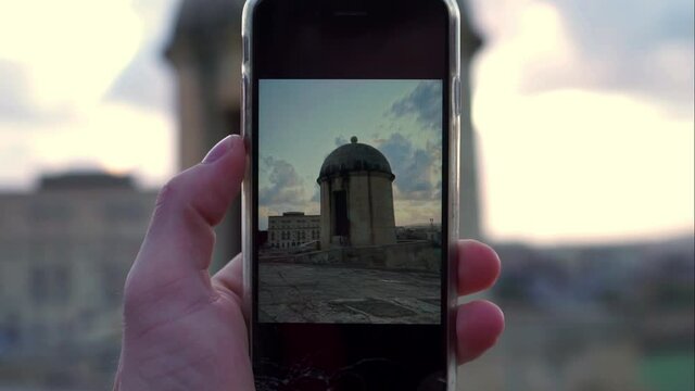 Taking a picture of a tower in Valletta (Malta)