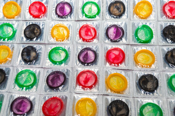 Colorful condoms background.