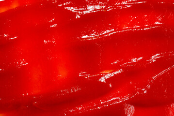 Red sauce splashes as background.