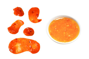 Orange spicy sauce splashes isolated on white background.