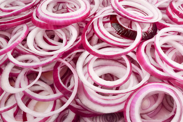 Onion rings as a background. Top view.