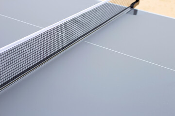 Net of table tennis ping pong on grey background