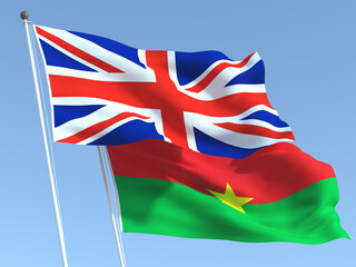 The flags of United Kingdom and Burkina Faso on the blue sky. For news, reportage, business. 3d illustration