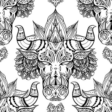 Seamless pattern with ethnic bull head with mehendi decoration and mandala on white background. Symbol of the new year with tribal decoration. Vector texture for fabric, wallpaper and your creativity