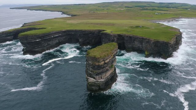 Aerial view of an astonishing sea stack, Dun Briste in Mayo. Legend attests that St Patrick drove all the vipers from Ireland onto the stack on Downpatrick Head, leaving the mainland snake-free.