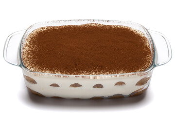 Traditional Italian Tiramisu dessert in glass baking dish isolated on white background with clipping path