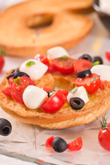 Friselle with tomatoes and mozzarella cheese.
