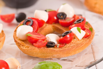 Friselle with tomatoes and mozzarella cheese.