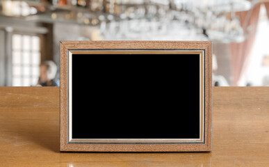 old photo frame on the wooden table