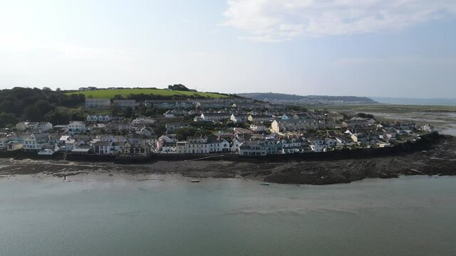 Appledore Devon aerial left to right along waterfront with tide out town and green hills  in background