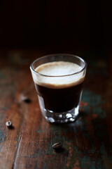 Coffee with milk on dark wooden background. Close up.	