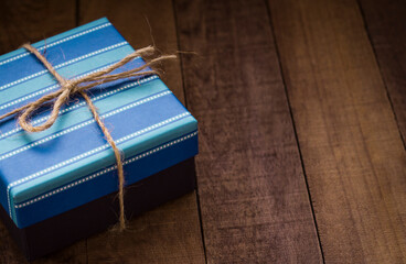 Vintage blue gift box on an old wooden background