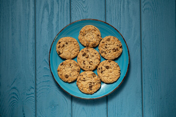 TOP VIEW: Cookies on a blue plate on a blue table
