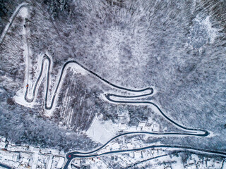 Seasons Concept winter snowy Aerial view Winding road serpentine mountain pass village Brodenbach Germany