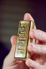 golden bar on the man's hand