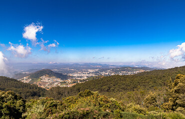 city view of ooty with south indian mountain range doddabetta and dramatic blue sky