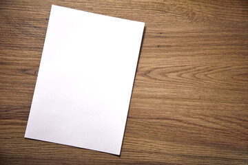 empty paper blank on wooden background