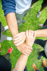 Solidarity unite people hands together community teamwork. Hands of spirit team working together outdoor. Unity strong handshake with people or agreement of feeling or happy diverse education action