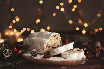 Traditional German Christmas cake - Cranberry Stollen, Christmas tree, ornaments, and candles