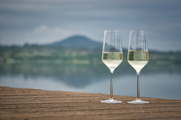 Two glass of champagne in the rain