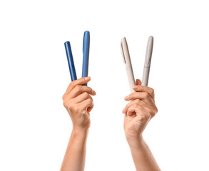 Female hands with syringes for insulin injection on white background. Diabetes concept