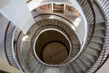 Stairs and Foucault's Pendulum suspended within the belfry or Radziejowski Tower on Cathedral Hill,...