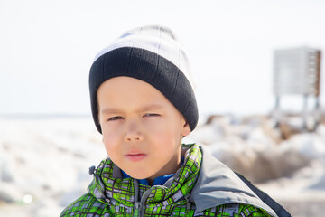 portrait of a boy on a bright winter day