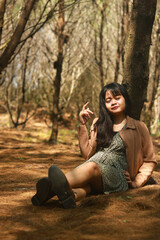 Outdoor lifestyle portrait of beautiful young asian woman on the beach.