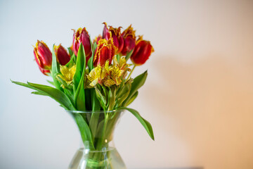 Bouquet of red tulips in a transparent vase
