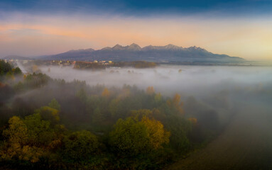 beautiful landscape with valleys, mountains in High Tatras in fog